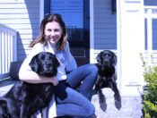 Lizzie with two black dogs