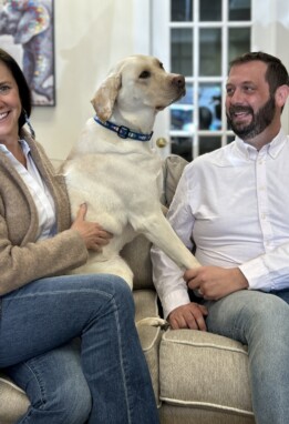 Liz Wade and Peter Glionna with Folsey the yellow lab